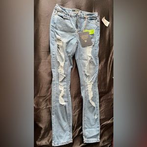 Ripped light blue recycled denim jeans . 27 W , 29 L